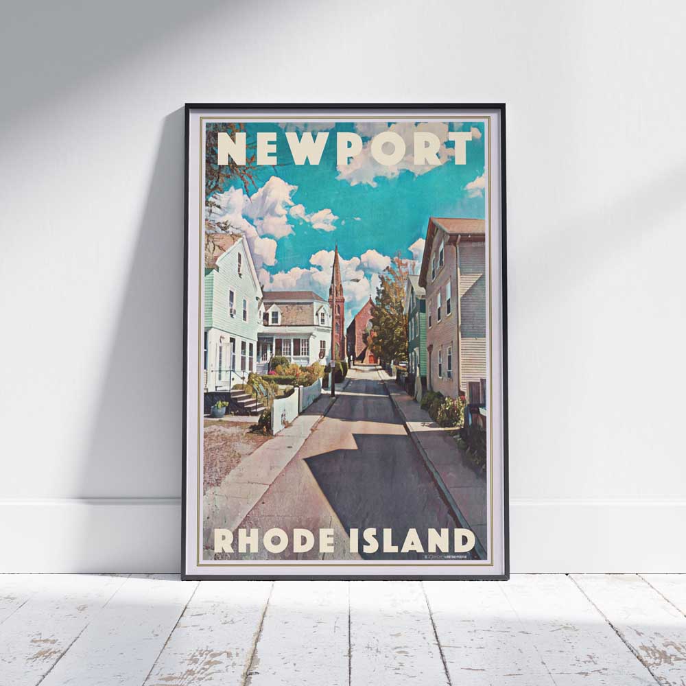 Framed travel poster of Newport Rhode Island on a white wooden floor, showcasing the historic Fair Street