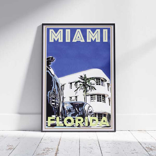 "Miami Cadillac" framed travel poster by Alecse on a white wooden floor, capturing the essence of Florida's iconic city in limited edition art