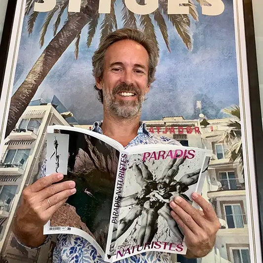 Alecse proudly posing with the Paradis Naturistes book (Mucem, Éditions de la Martinière)