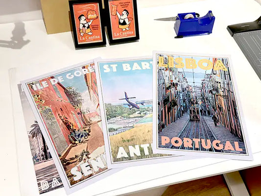 Limited edition travel posters by Alecse and Cha presented inside the MyRetroPoster Sitges gallery.