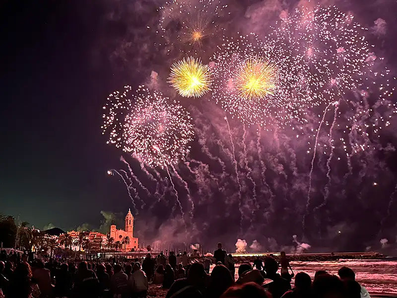 Fireworks illuminating the skyline of Sitges during the Festa Major celebrations, one of the town’s most important cultural traditions.