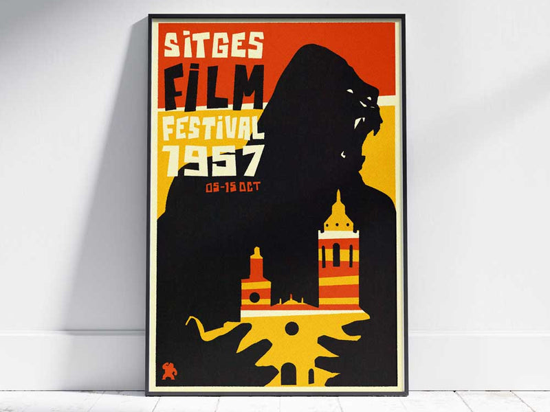 Sitges Fantastic Film Festival poster and postcard by Cha x Spanish Capsule™ on a white wooden floor