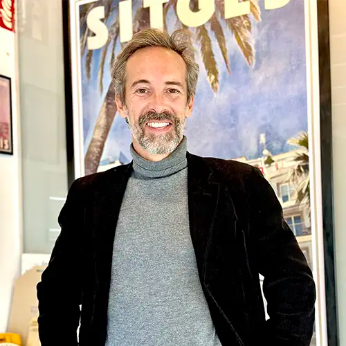 Portrait of Alecse, vintage travel poster artist in his Sitges gallery