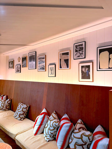 Framed St Barth St Jean vintage travel poster by Alecse displayed inside a luxury hotel in Gustavia, St Barth, shown in a refined black and white tonal version.