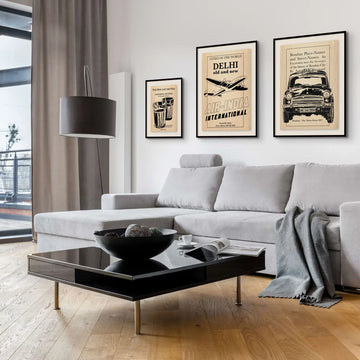 A modern living room featuring the Delhi - Air India vintage poster alongside two other illustrations from The Great Indian Decor™ by Shree, a collection celebrating Indian heritage with a retro aesthetic. 