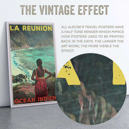 The image is a vintage travel poster for "La Reunion" by Alecese, featuring a woman in a red dress standing in front of a scenic ocean view. The poster has a vintage aesthetic, with a half-tone rendering that mimics the way posters were printed in the past. The larger the artwork, the more visible the effect.
