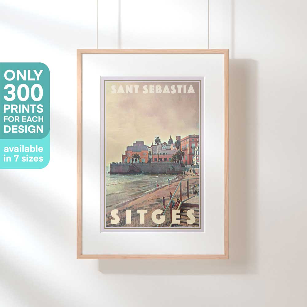 Limited edition travel poster of Sant Sebastia, Sitges, displayed in hanging frame, highlighting 300 exclusive prints