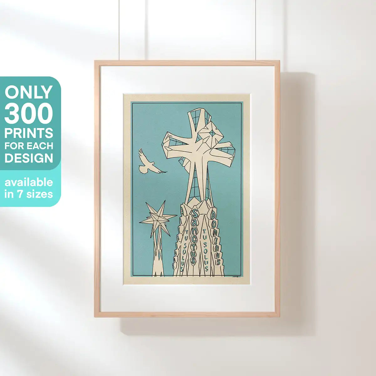 Hanging Sagrada Sanctus poster depicting the iconic cross and pinnacle of Gaudí’s Sagrada Familia in Barcelona