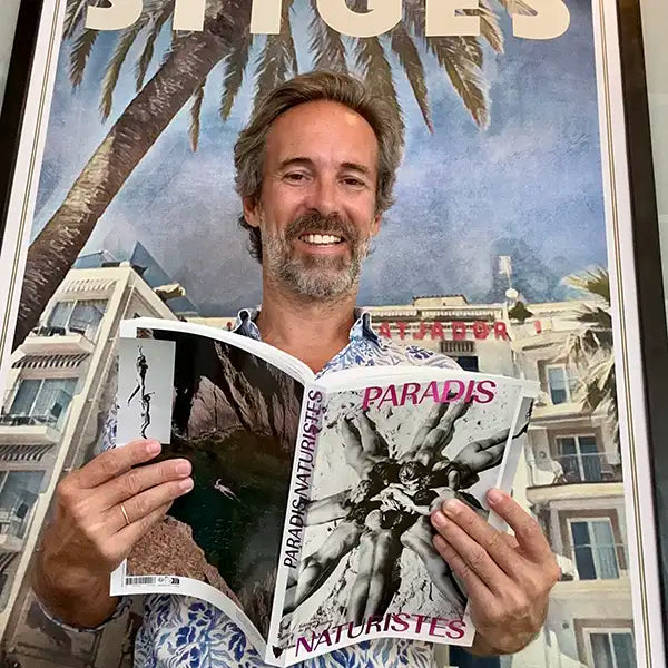 Alecse reading the book “Paradis Naturistes” by MUCEM, published by Éditions de La Martinière, featuring his Sitges Bears Week 2023 poster illustration