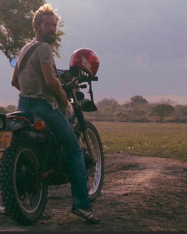 Poster artist Alecse, a retro enthusiast, in the middle of the jungle of eastern Sri Lanka, showcasing his passion for travel that inspires his work