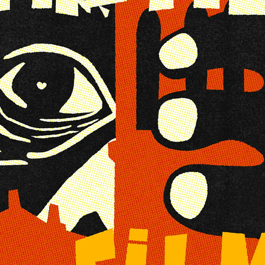 Close-up of King Kong eye and fingers behind Sitges bell tower in red, yellow and black