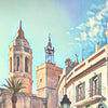 Close-up of the townhall square with Santa Tecla in the background in Alecse's Sitges Travel Poster Showcasing Soft Focus Artistic Style