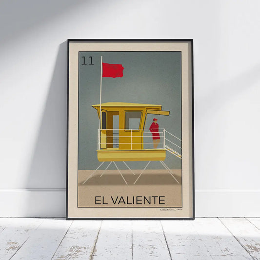 Framed El Valiente Sitges poster by Cha leaning on floor, limited edition of 300 prints from the Lotería Sitgetana series