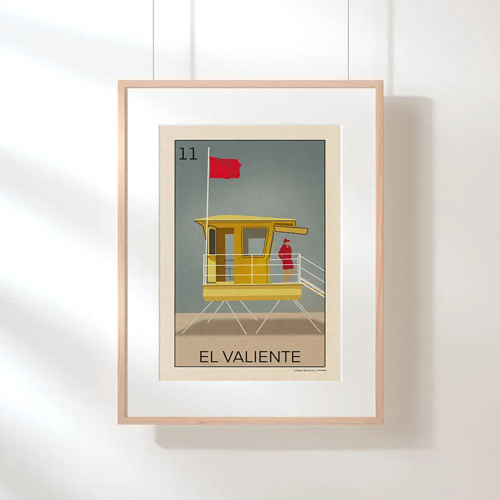 Hanging El Valiente poster by Cha with “only 300 prints” badge, part of the Lotería Sitgetana limited edition series featuring a Sitges lifeguard tower