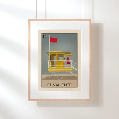 Hanging El Valiente poster by Cha with “only 300 prints” badge, part of the Lotería Sitgetana limited edition series featuring a Sitges lifeguard tower