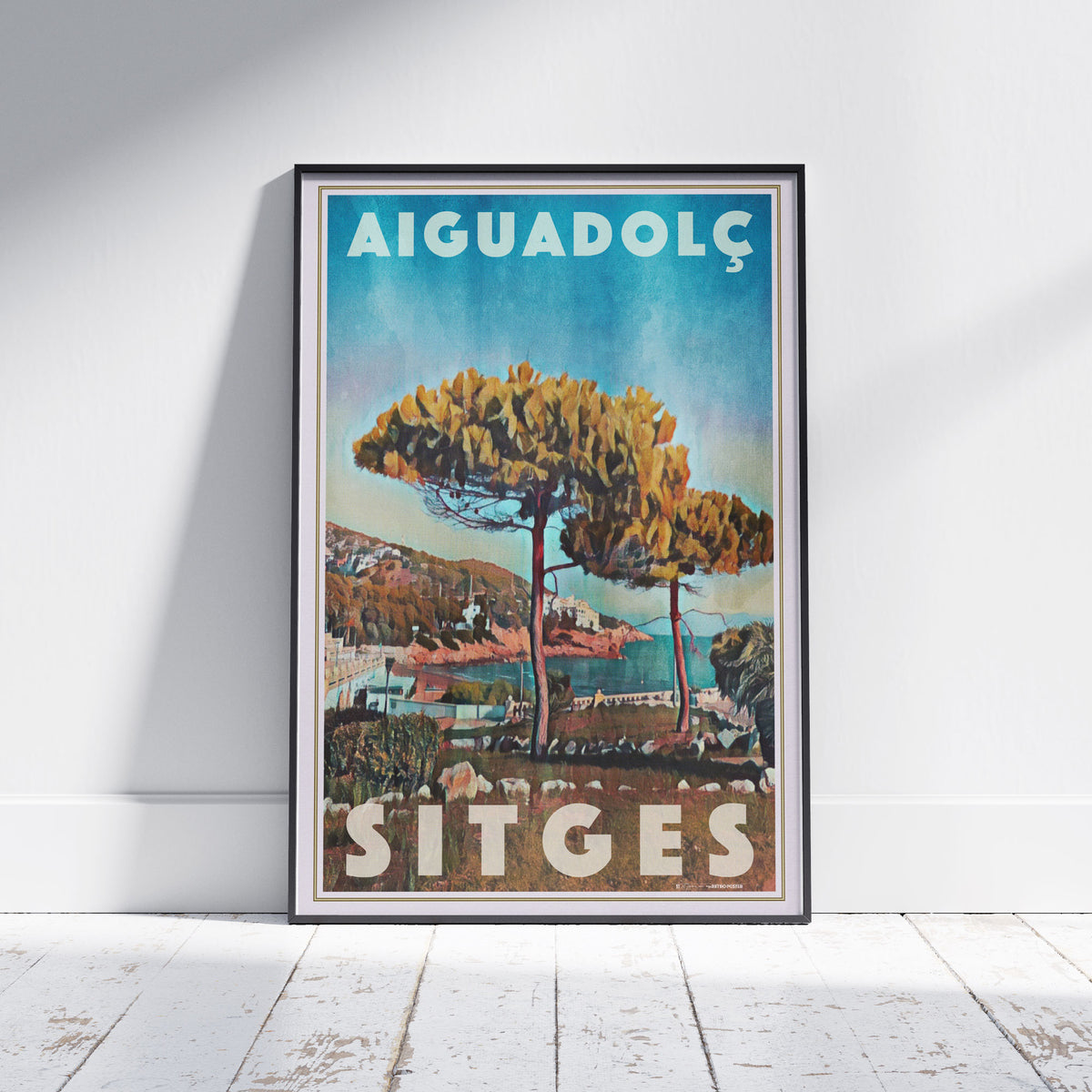 Framed Aiguadolç Sitges poster by Alecse depicting pine trees above the Aiguadolç marina in soft halftone tones.