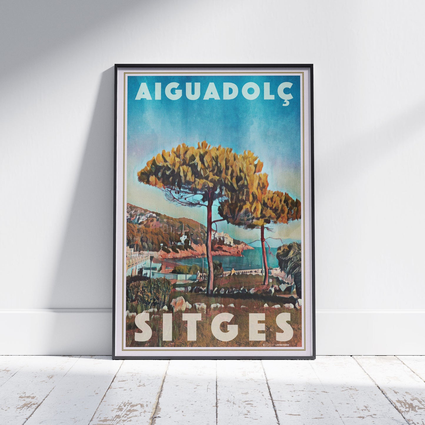 Framed Aiguadolç Sitges poster by Alecse depicting pine trees above the Aiguadolç marina in soft halftone tones.