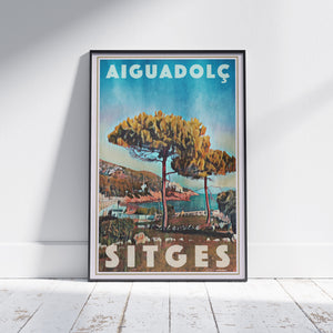 Framed Aiguadolç Sitges poster by Alecse depicting pine trees above the Aiguadolç marina in soft halftone tones.
