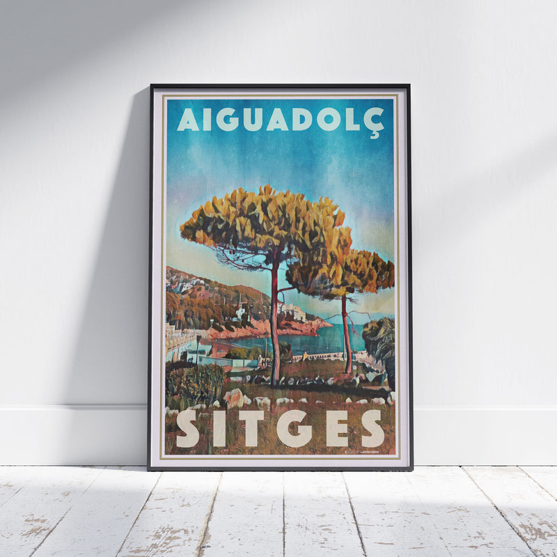 Framed Aiguadolç Sitges poster by Alecse depicting pine trees above the Aiguadolç marina in soft halftone tones.