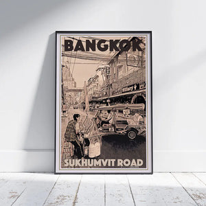 Framed Bangkok Sukhumvit Road travel poster by Alecse displayed on white wall with light wood frame