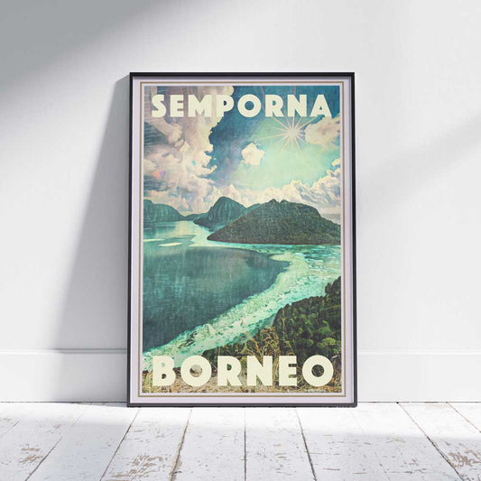 A framed travel poster of Borneo's Semporna on a white wooden floor—limited edition artwork by Alecse