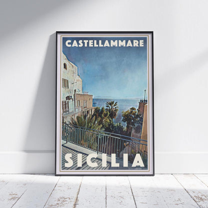 Castellammare poster framed and leaning against a white wall with wooden floor