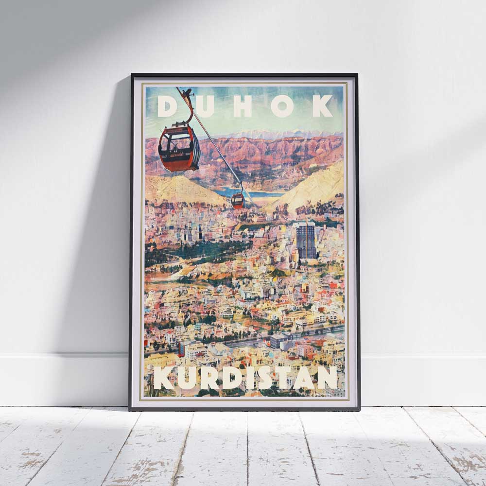 Vintage travel poster of Duhok Kurdistan with cable cars and mountain view, framed and displayed on white wood floor