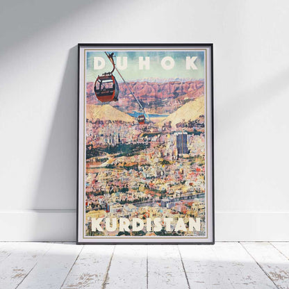 Vintage travel poster of Duhok Kurdistan with cable cars and mountain view, framed and displayed on white wood floor