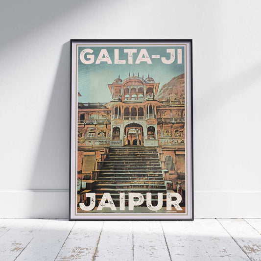 An elegantly framed travel poster of Jaipur's Galta-Ji on a pristine white floor, a limited edition piece by Alecse