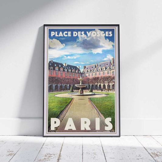 Place des Vosges Paris travel poster in a frame on a white wooden floor.
