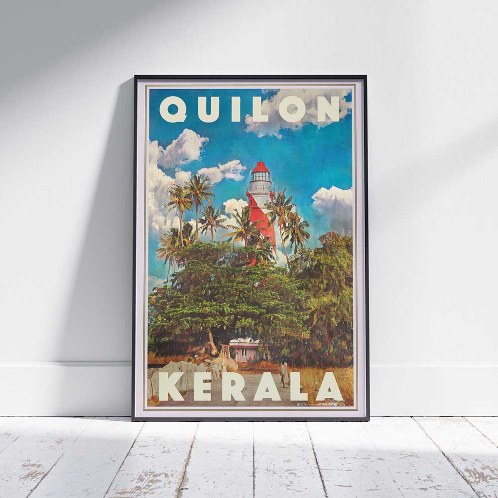 Framed Quilon Kerala travel poster on a white wooden floor, showcasing the vibrant tropical scene of the lighthouse and palm trees