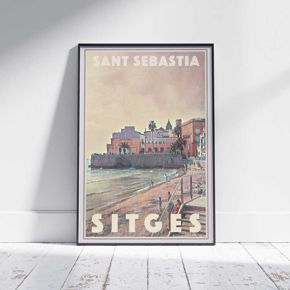 Framed limited edition travel poster of Sitges, Catalonia, on a white wooden floor - Sant Sebastia by Alecse