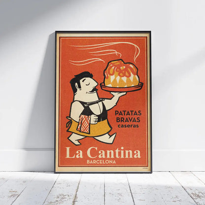 La Cantina Bravas poster framed on a white wooden floor, featuring a smiling waiter with a plate of patatas bravas