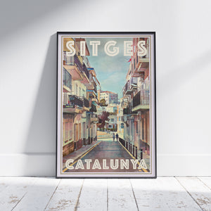 Framed Sitges Calipolis poster by Alecse showing a sunlit Catalan street leading toward the Calipolis Hotel in vintage tones.
