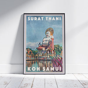 Framed Big Laughing Buddha Koh Samui Travel Poster on a white wooden floor, showcasing the temple and statue in Surat Thani, Thailand. Limited edition, 300 copies