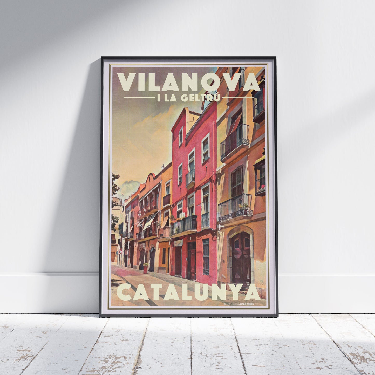 Framed Plaça Llarga Vilanova poster showing vibrant pastel buildings and afternoon light in Alecse’s vintage halftone style.