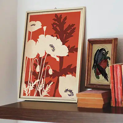 poppy flower poster papaver rhoeas framed wall art styled on shelf with books and vintage illustration warm interior decor limited edition