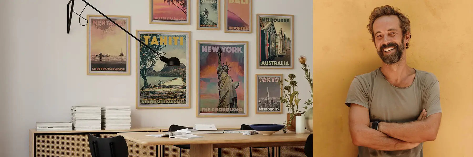 Interior wall decorated with Alecse's retro travel posters, next to a portrait of Alecse, co-founder and artist at MyRetroposter