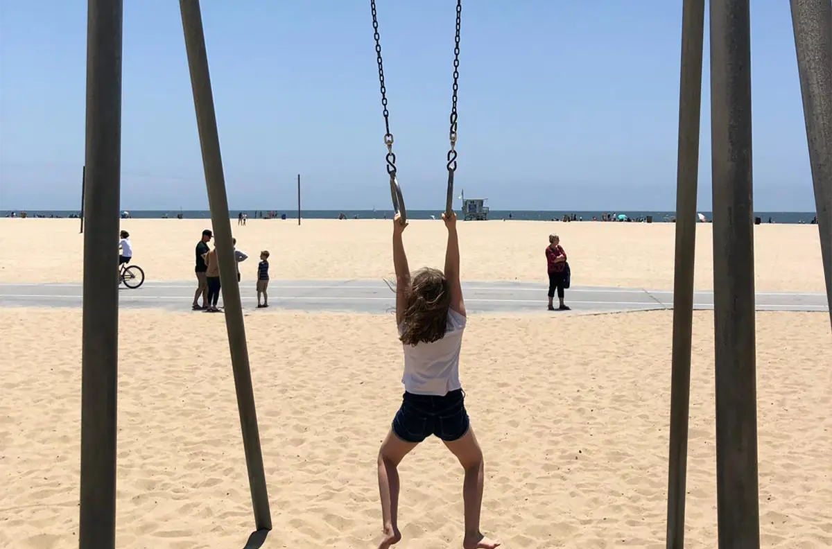 Original photo of Malibu Beach with distant lifeguard tower and minimal palm trees, before artistic enhancement.