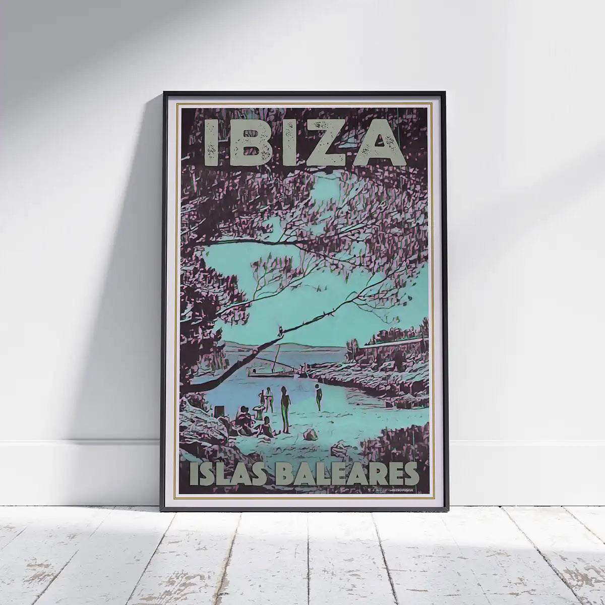 San Antonio Beach Vintage Ibiza poster by French Artist Alecse, showcased framed on a white wooden floor