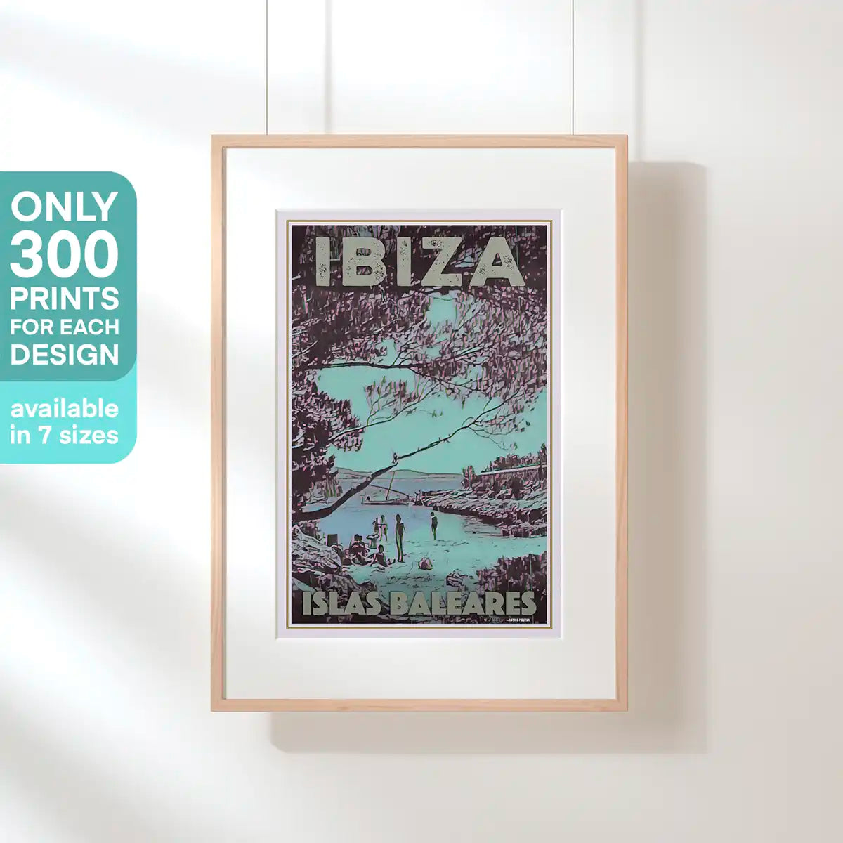Framed poster of Ibiza with a scenic design on a white wall. Ibiza San Antonio poster – limited edition of 300 prints