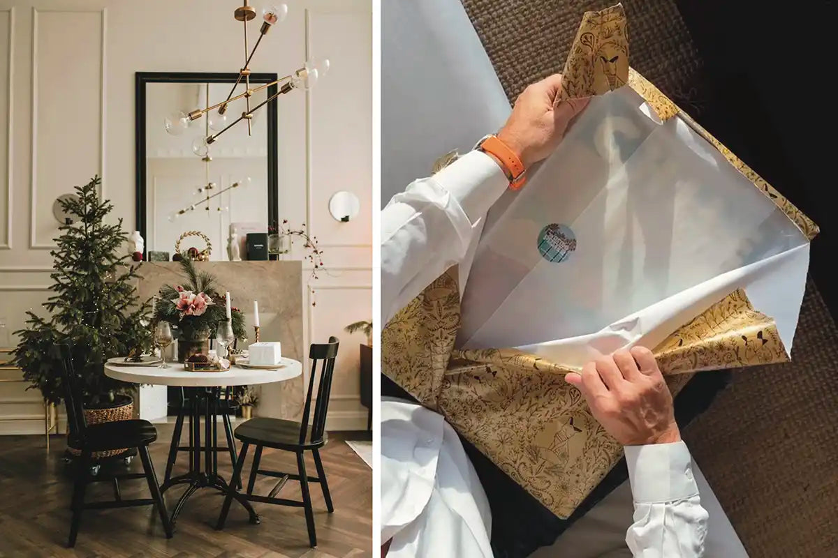 Cozy Christmas interior with a decorated tree and festive table setting beside a person unwrapping a limited-edition art print in elegant gold wrapping paper.