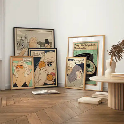 Framed comic-style posters from the Soft Pop Studio™ collection by Cha displayed in a cozy modern interior, featuring retro female portraits with humorous quotes and muted pastel tones.