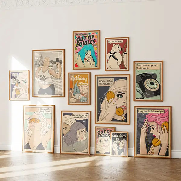 Framed comic-style posters from the Soft Pop Studio™ collection by Cha displayed in a cozy modern interior, featuring retro female portraits with humorous quotes and muted pastel tones.