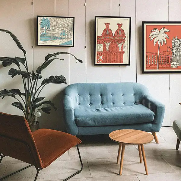 Playful and colorful wall art from the Spanish Capsule™ collection by Cha, featuring retro-style posters of scenic views of Barcelona.