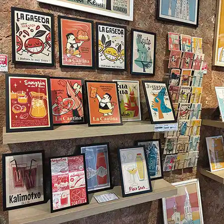 Spanish Capsule collection by artist Cha, featuring colorful retro Spanish posters and postcards displayed at the MyRetroPoster gallery in Barcelona.