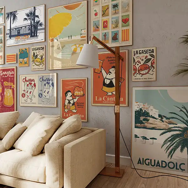 Playful and colorful wall art from the Spanish Capsule™ collection by Cha, featuring retro-style posters of churros, sangria, patatas bravas, Barcelona beach scenes, and vintage matchbox-inspired designs.