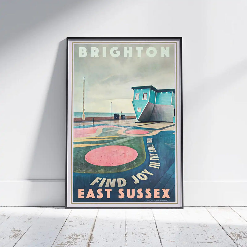 Framed Brighton Upside Down House poster displayed in a modern interior, vintage seaside wall art by Alecse