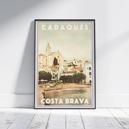 Cadaqués Church vintage travel poster framed on wall, featuring Santa Maria church overlooking the Costa Brava waterfront
