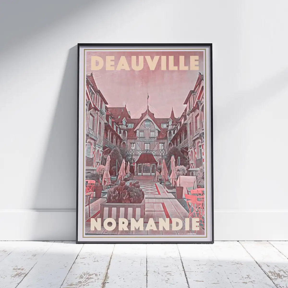Vintage travel poster of the Normandy Hotel in Deauville featuring a soft rosy colour palette, classic Norman architecture and retro typography, limited edition art print by Alecse